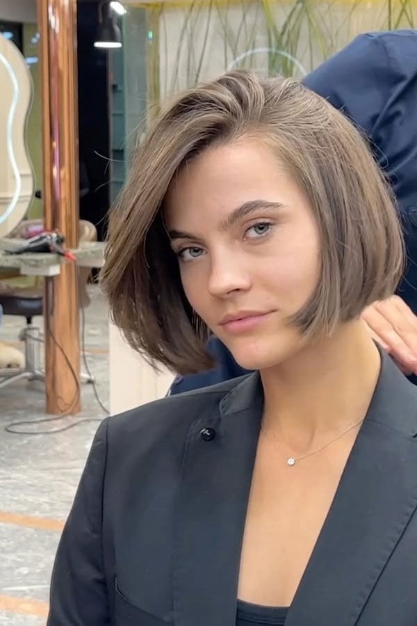 Platinum Blonde Bob With Dark Roots Platinum Blonde Bob With Dark Roots — Chin Length Bob