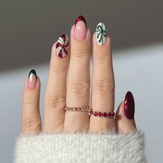 Medium Almond Nude With Green French Tips and Swirls Medium Almond Nude With Green French Tips and Swirls — Christmas Acrylic Nails