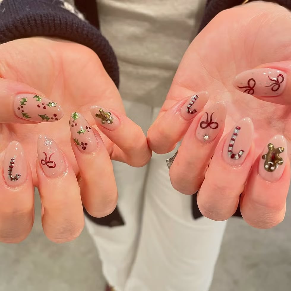Medium Almond Clear Base With Holly and Gingerbread Men Medium Almond Clear Base With Holly and Gingerbread Men — Christmas Acrylic Nails