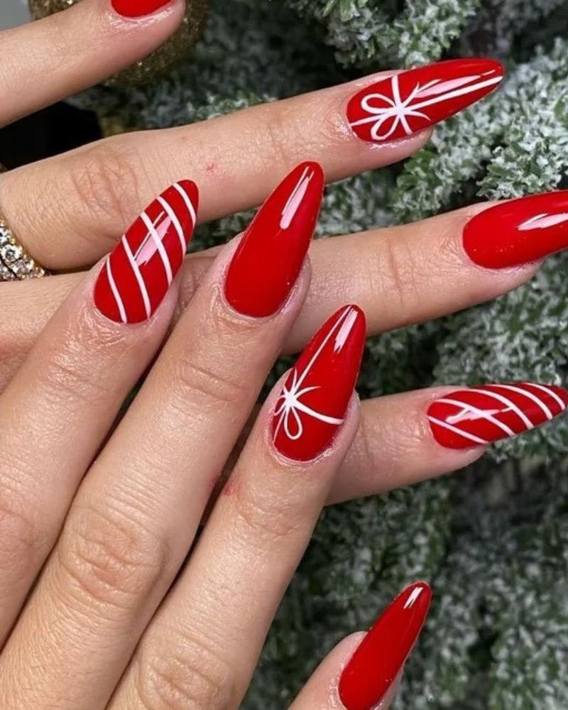 Long Stiletto Vibrant Red With White Stripes and Bows Long Stiletto Vibrant Red With White Stripes and Bows — Christmas Acrylic Nails