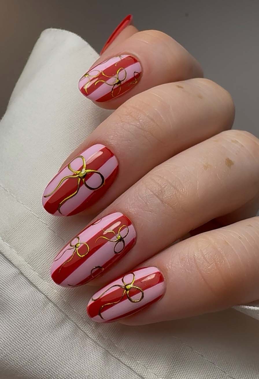Gold Bow Red and Pink Stripe Medium Almond Nails Gold Bow Red and Pink Stripe Medium Almond Nails — Christmas Nails