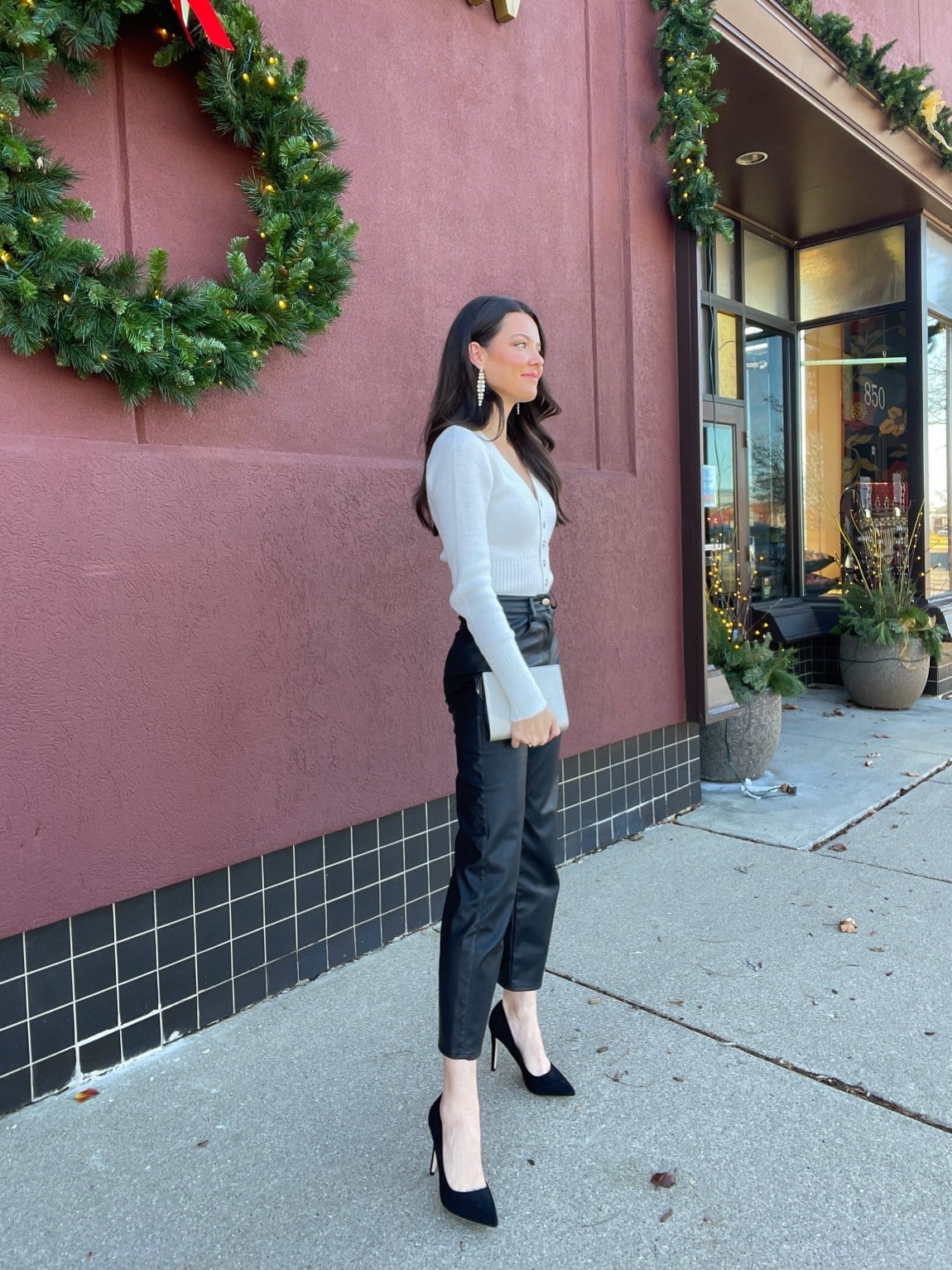 White Cardigan Over Turtleneck With Faux Leather, Office-Safe Version — Christmas Party Outfits Casual