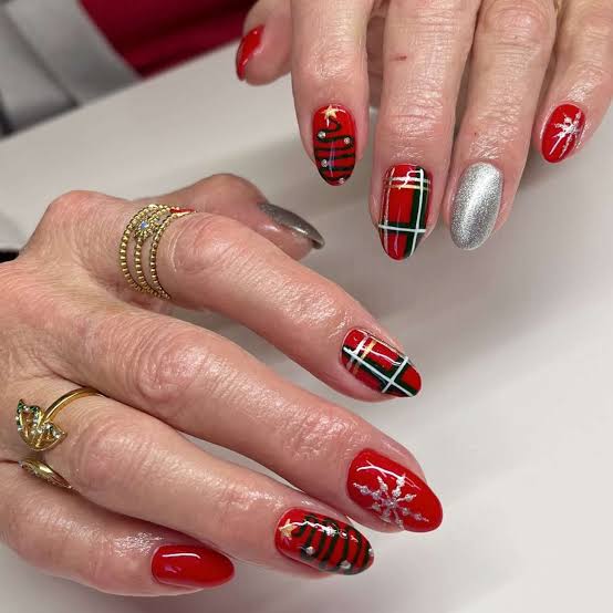 Short Almond Red Plaid with Snowflake Accent — Christmas Plaid Nails