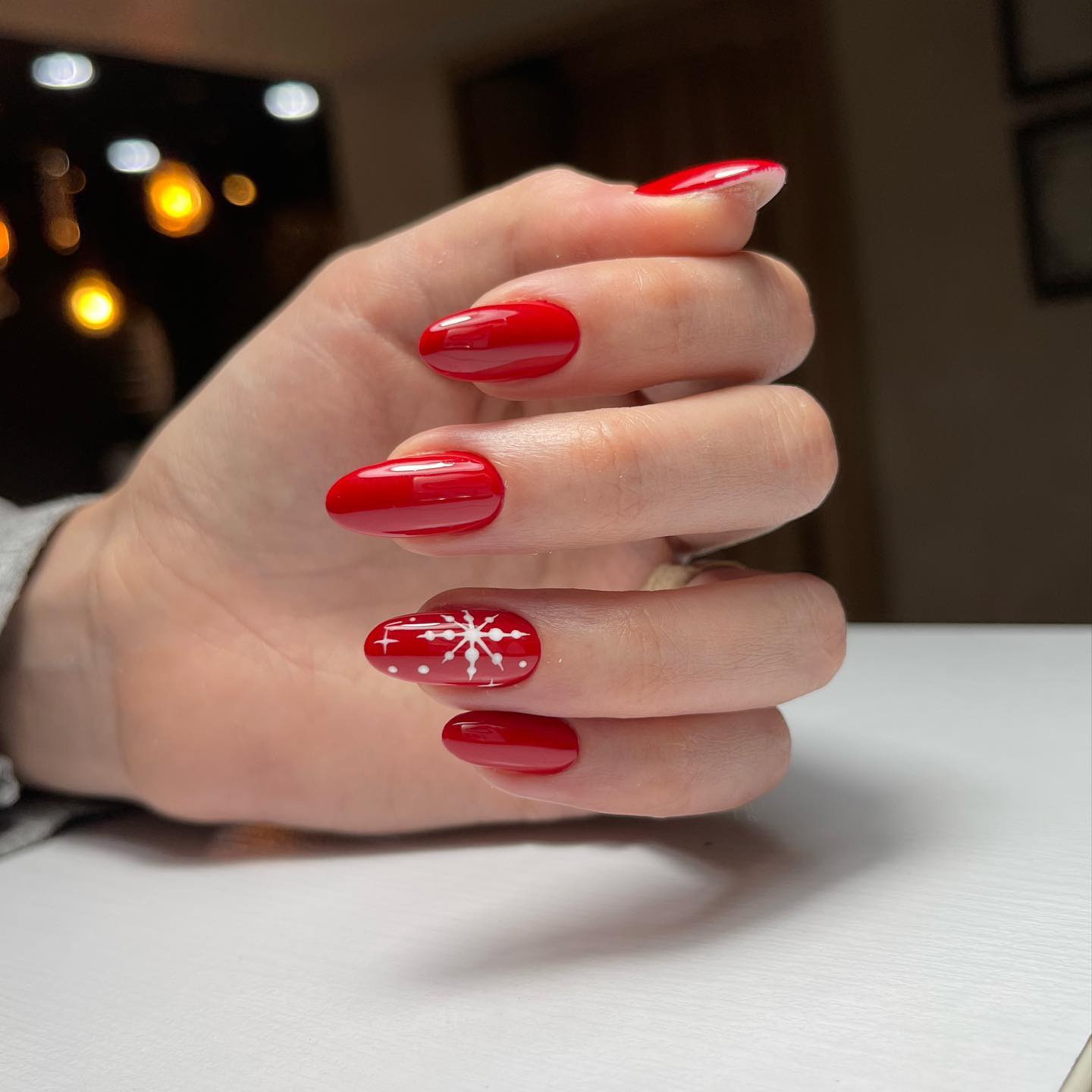 Classic Red Almond Nails with White Snowflakes