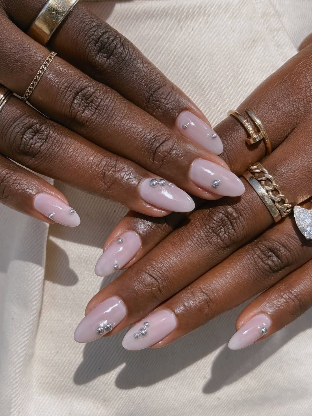 Silver Studs Sheer Milky Pink Short Almond Nails — Classy Nails