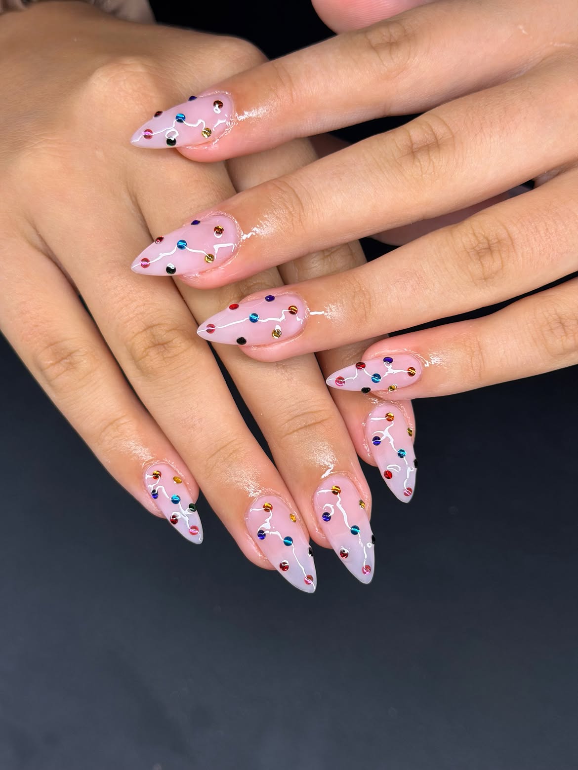 Clear Glossy Stiletto Nails with Colorful Christmas Lights