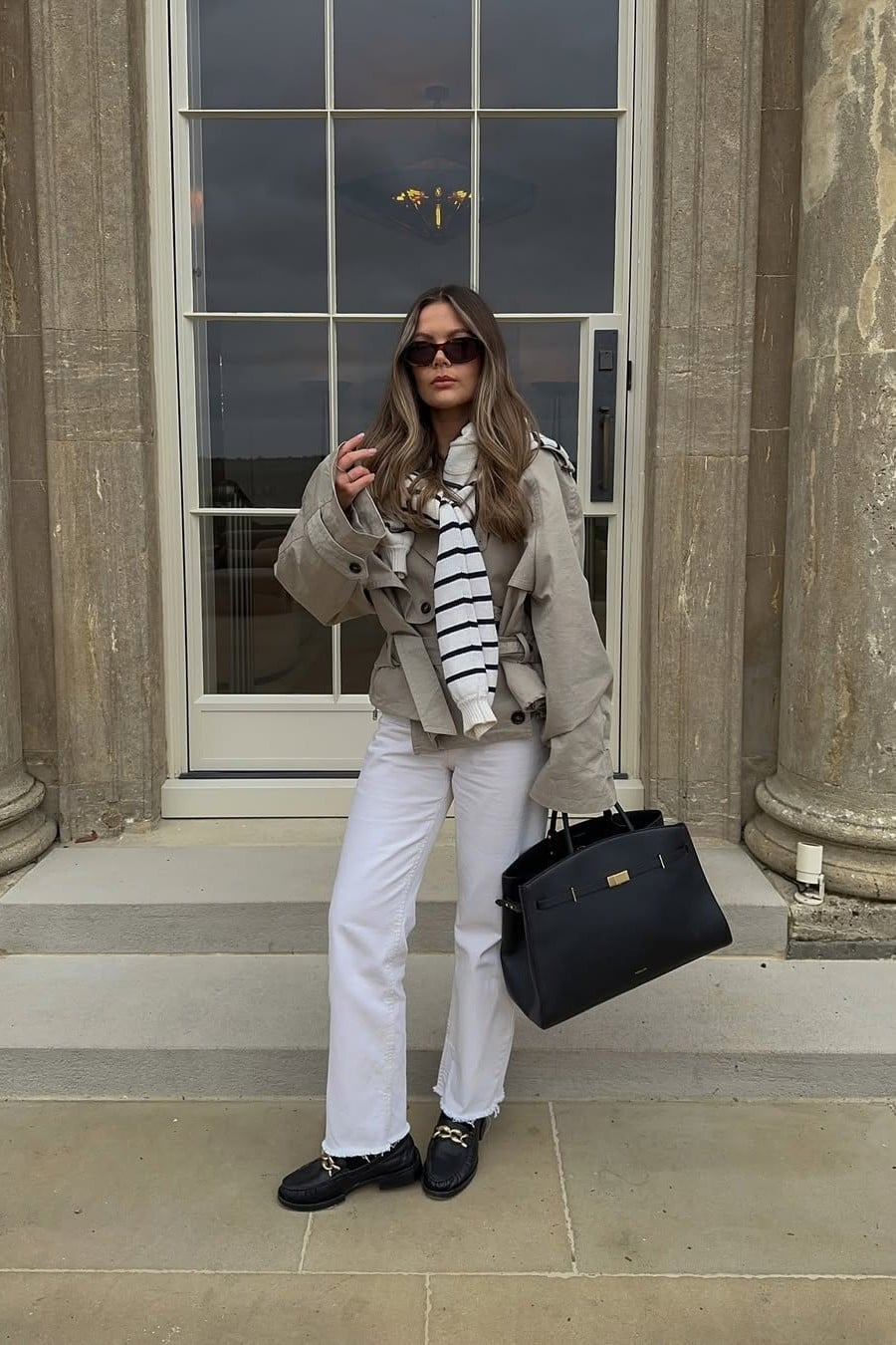 Beige Trench Coat Over Striped Scarf and White Jeans — Coastal Style