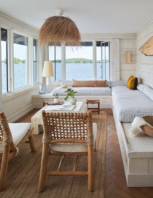 Bright Sunroom With Wicker and Surf Decor — Coastal Style