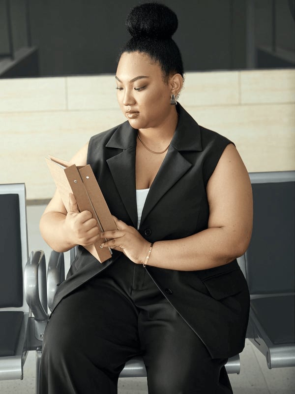 Gray Knit Cardigan Over Red Top and Black Trousers, Glasses — Conference Outfits