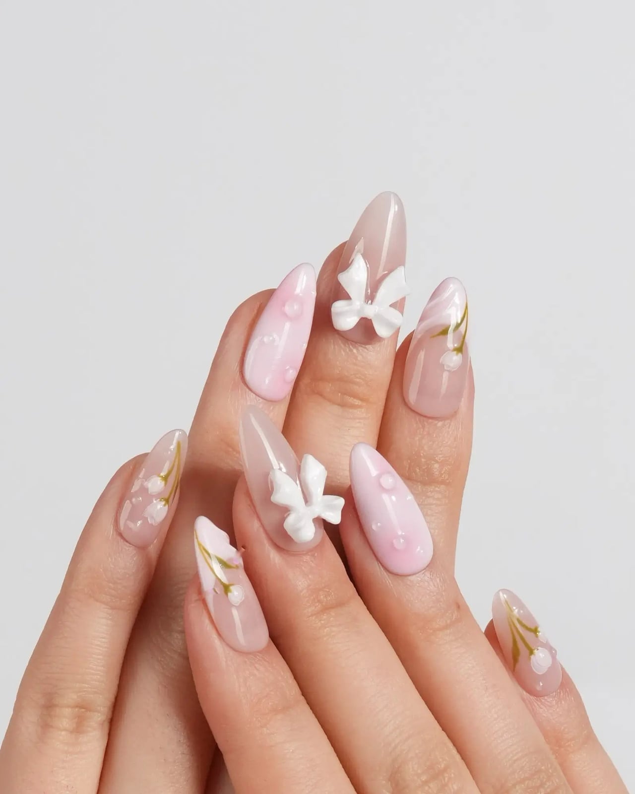 Medium Almond Sheer Pink with 3D Bows and Florals, Close-Up Take — Coquette Nails