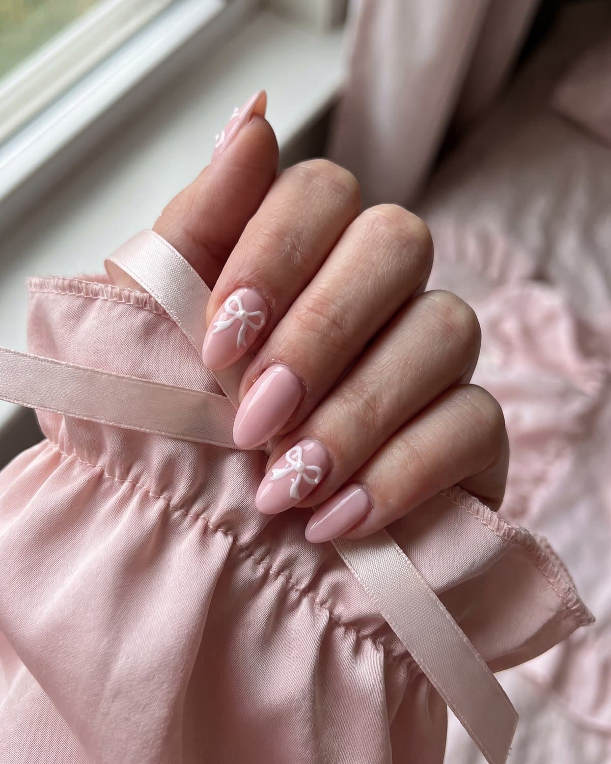 Short Oval Soft Pink with Raised White Bows — Coquette Nails