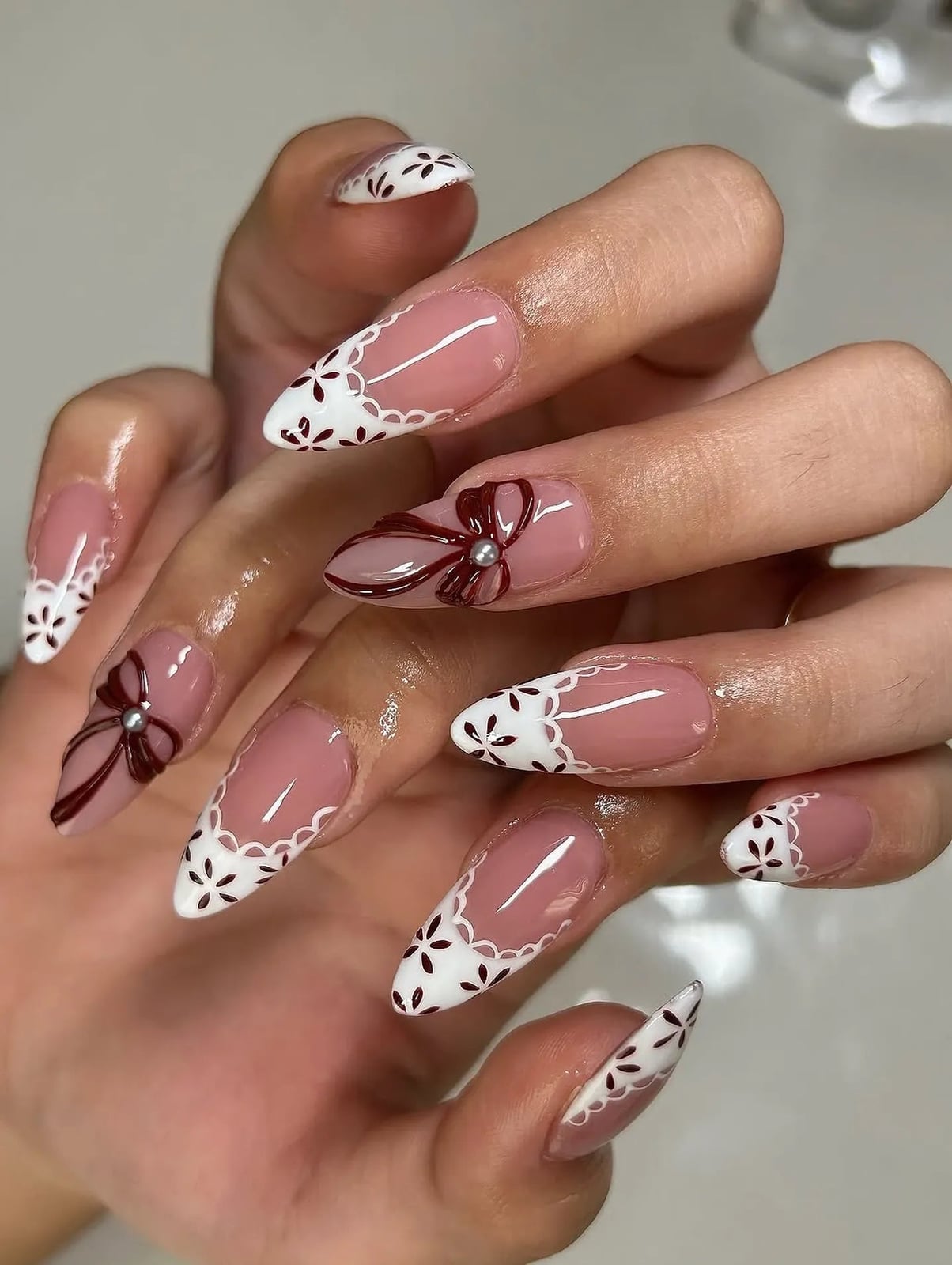 Long Stiletto French with Lace Pattern and Dark Red Bows — Coquette Nails