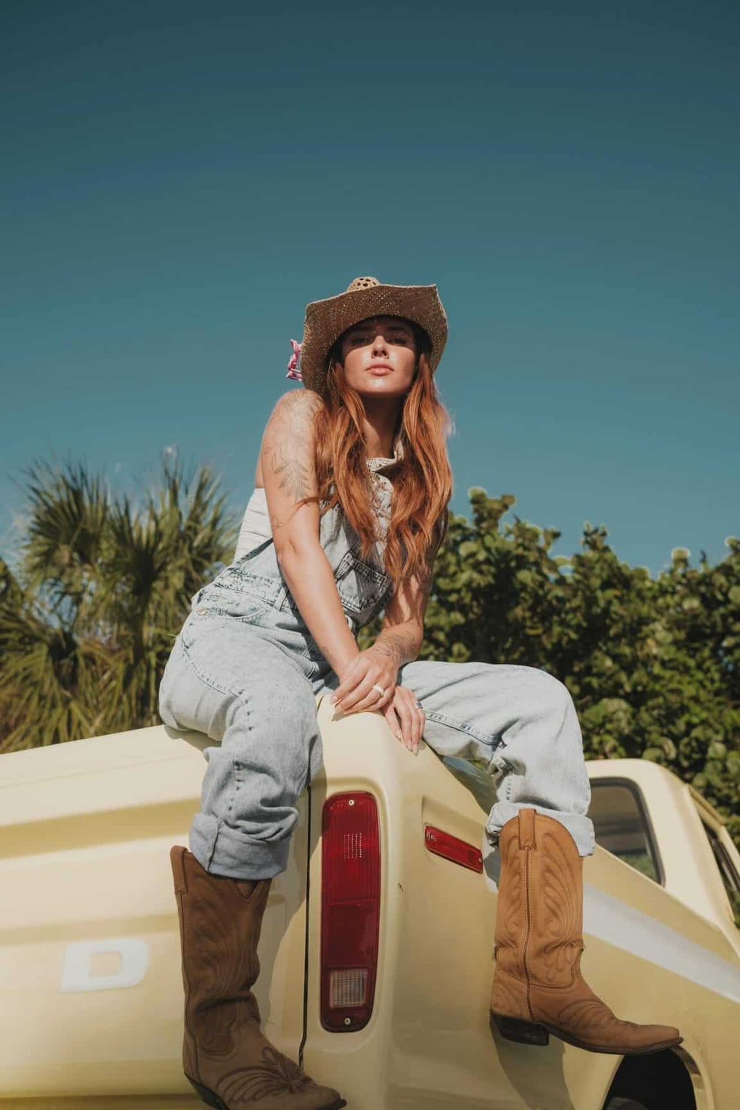 Denim Overalls With Cowboy Hat — Country Concert Outfits Ideas