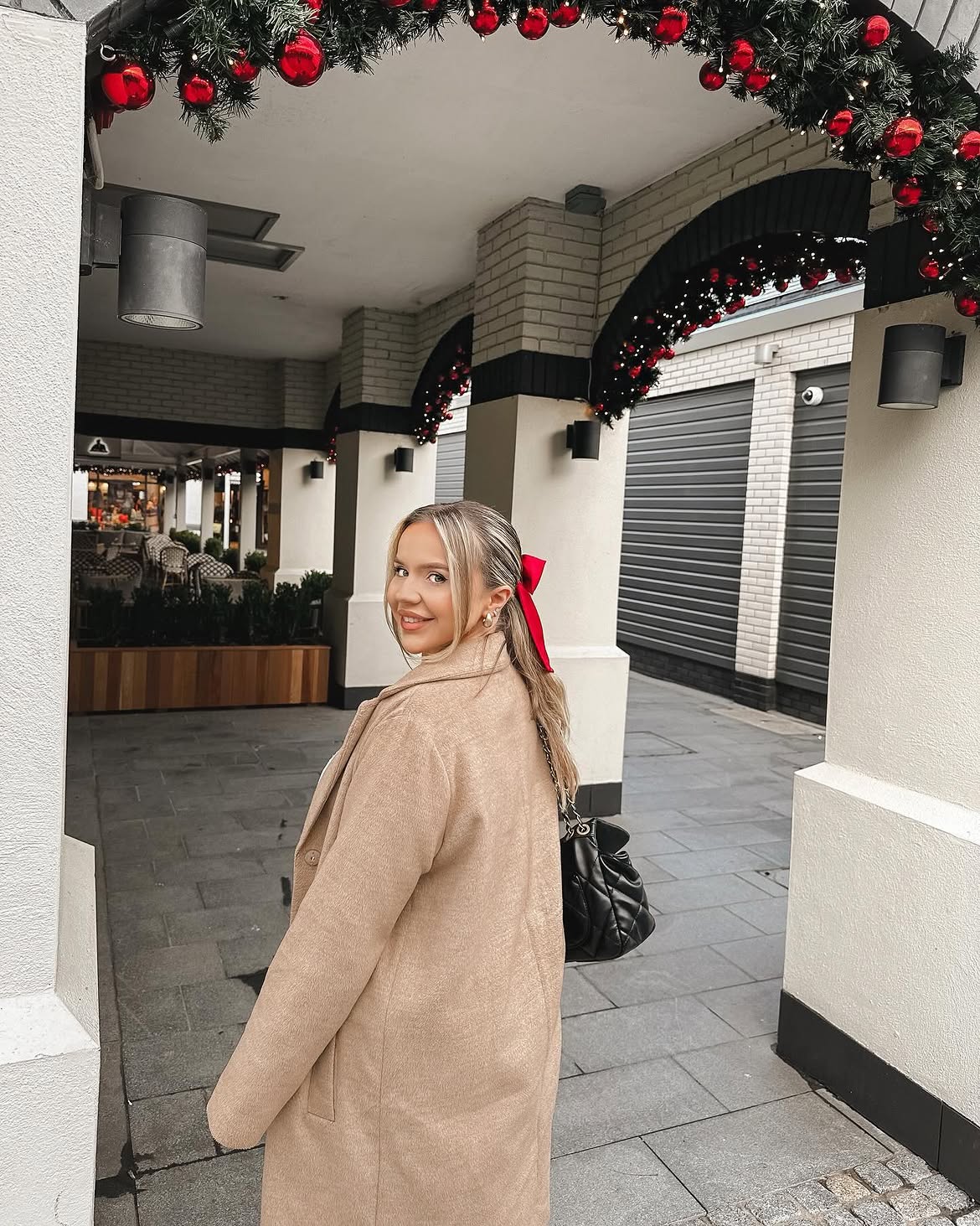 Cozy Camel Coat With Black Quilted Bag