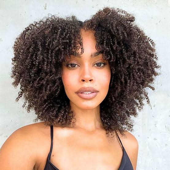 Mid-Back Defined Curls With Curly Bangs