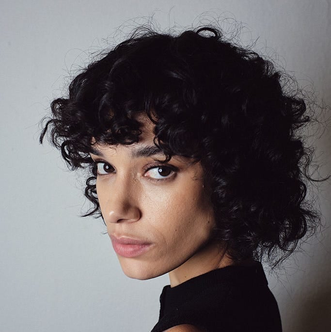Chin Length Black Bob With Voluminous Curls — Curly Bangs