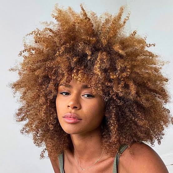 Afro With Honey Blonde Balayage And Curly Bangs