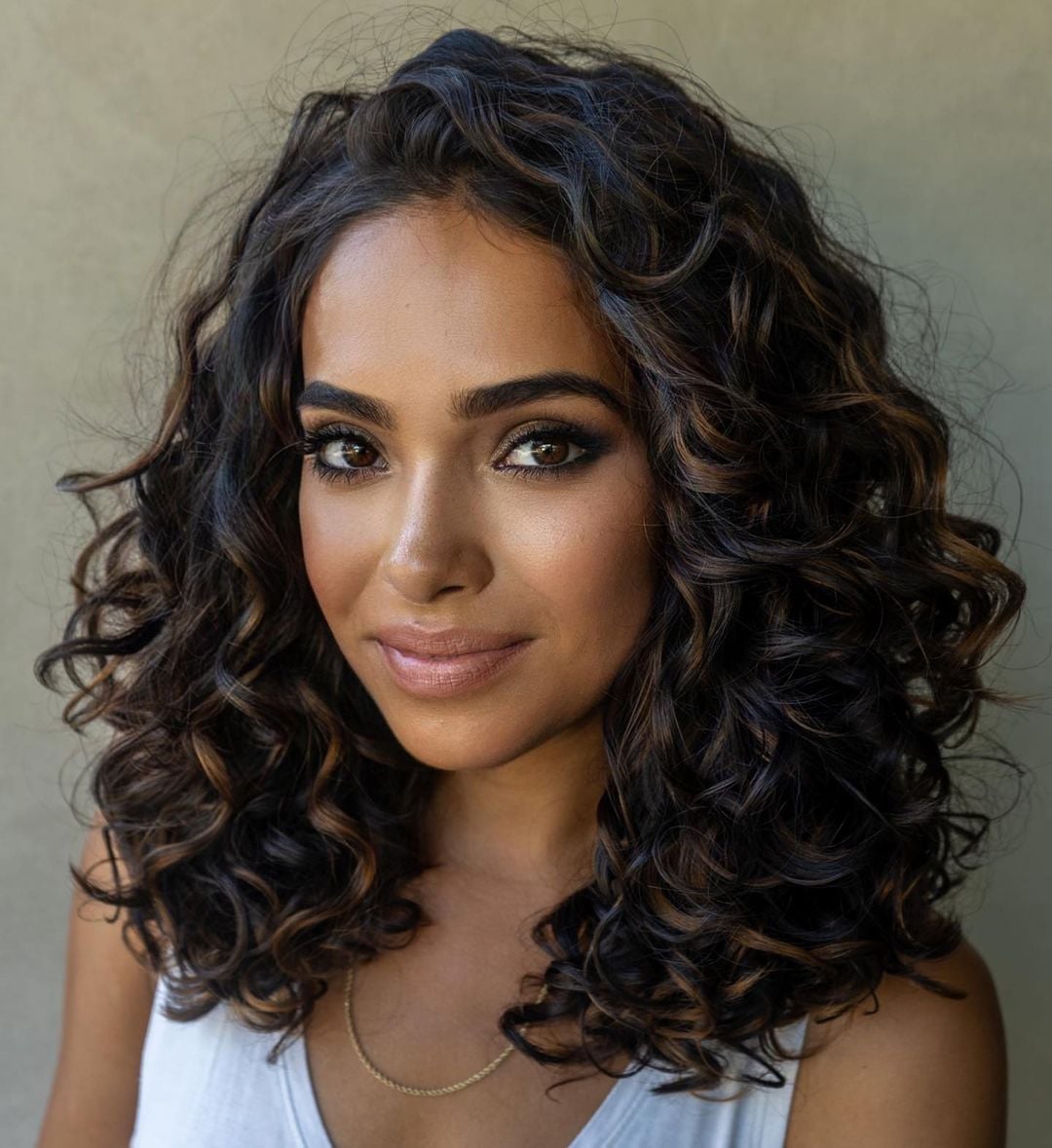 Medium Layered Curls With Caramel Highlights — Curly Hair Cuts