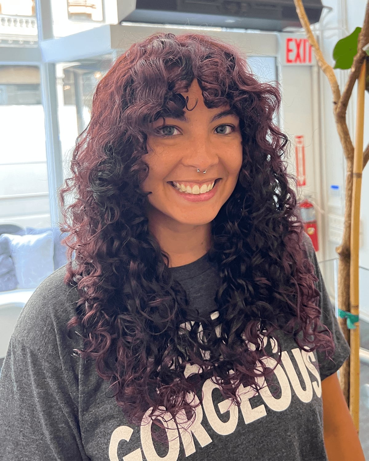 Collarbone Layers With Burgundy Highlights — Curly Hair Cuts