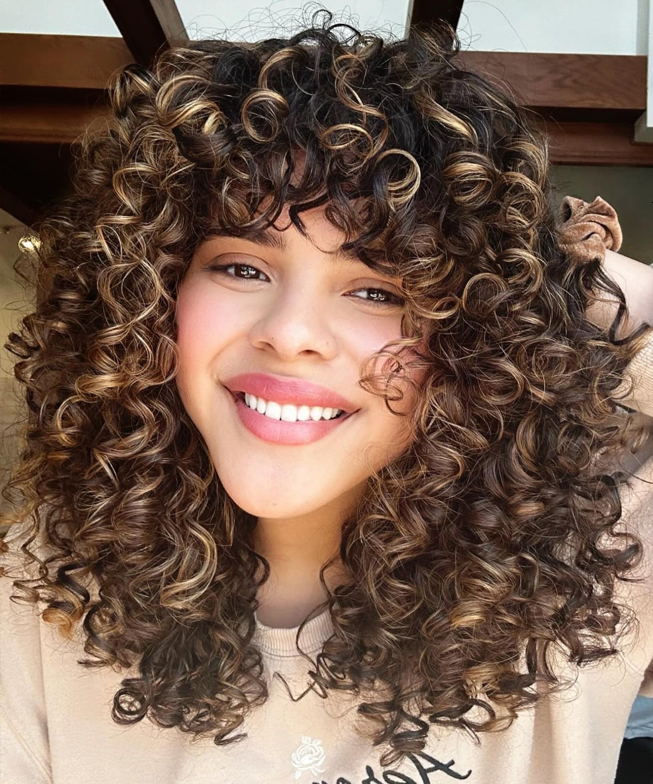 Collarbone Layers With Blonde Highlights — Curly Hair Layers