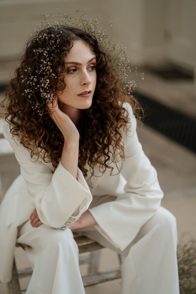 Collarbone Layers With Floral Accents Collarbone Layers With Floral Accents — Curly Hair Wedding