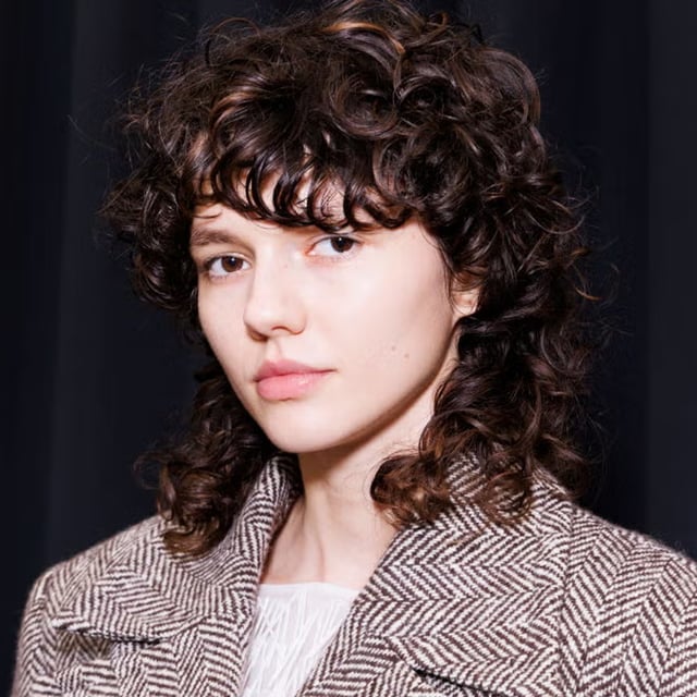 Collarbone Dark Brown Wolf Cut With Wispy Bangs, Side — Curly Wolf Cut
