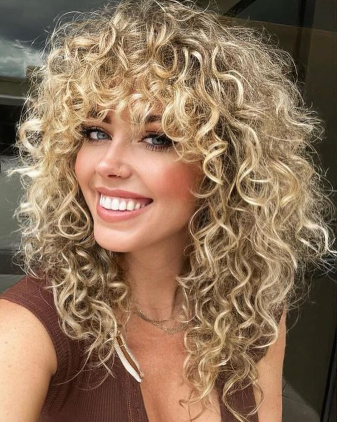 Ash Blonde Shoulder Length Wolf Cut With Curly Bangs — Curly Wolf Cut