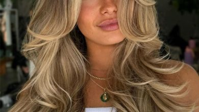 Golden Blonde Balayage Layers with Curtain Bangs for Long Hair