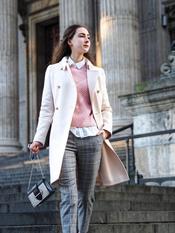 Cream Wool Coat Over Pink Sweater And Plaid Trousers — Cute Winter Outfits for Women