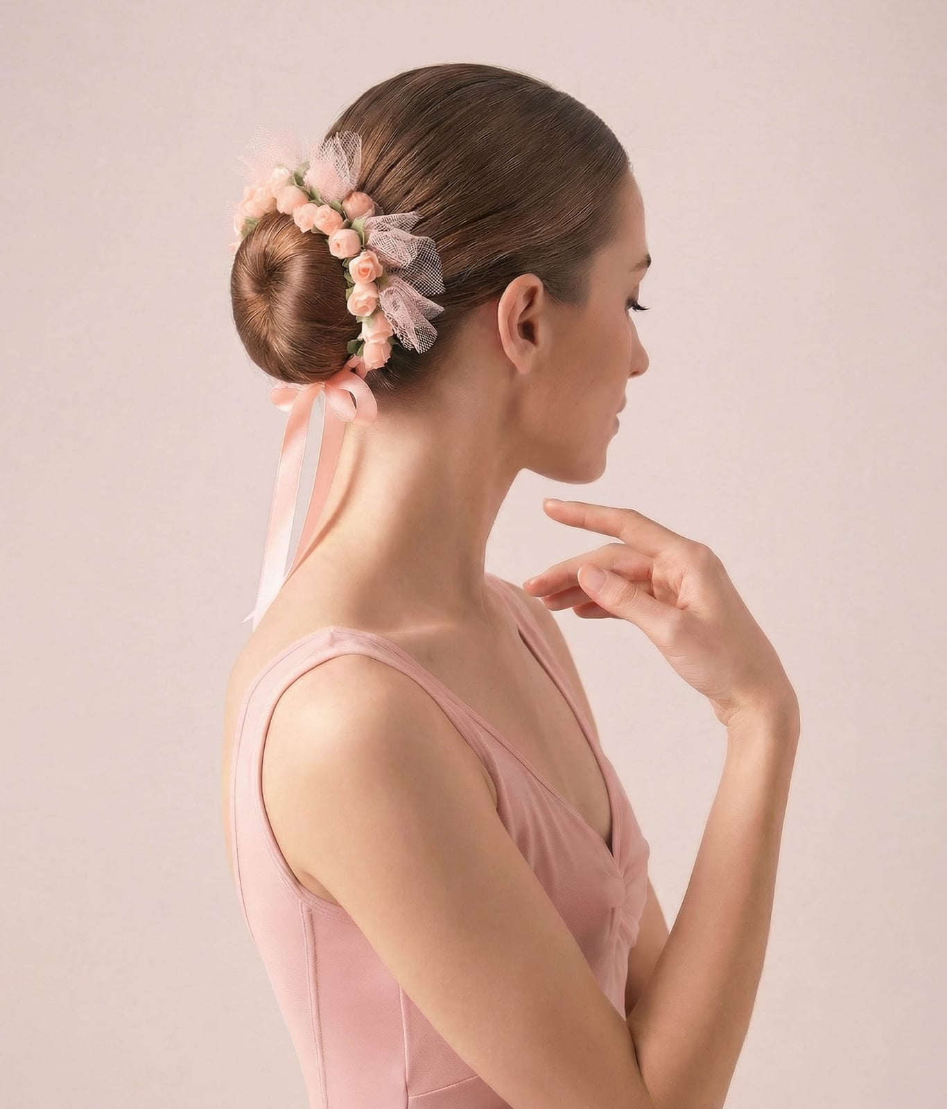 Medium Brown Bun With Floral Accessory — Dance Hair