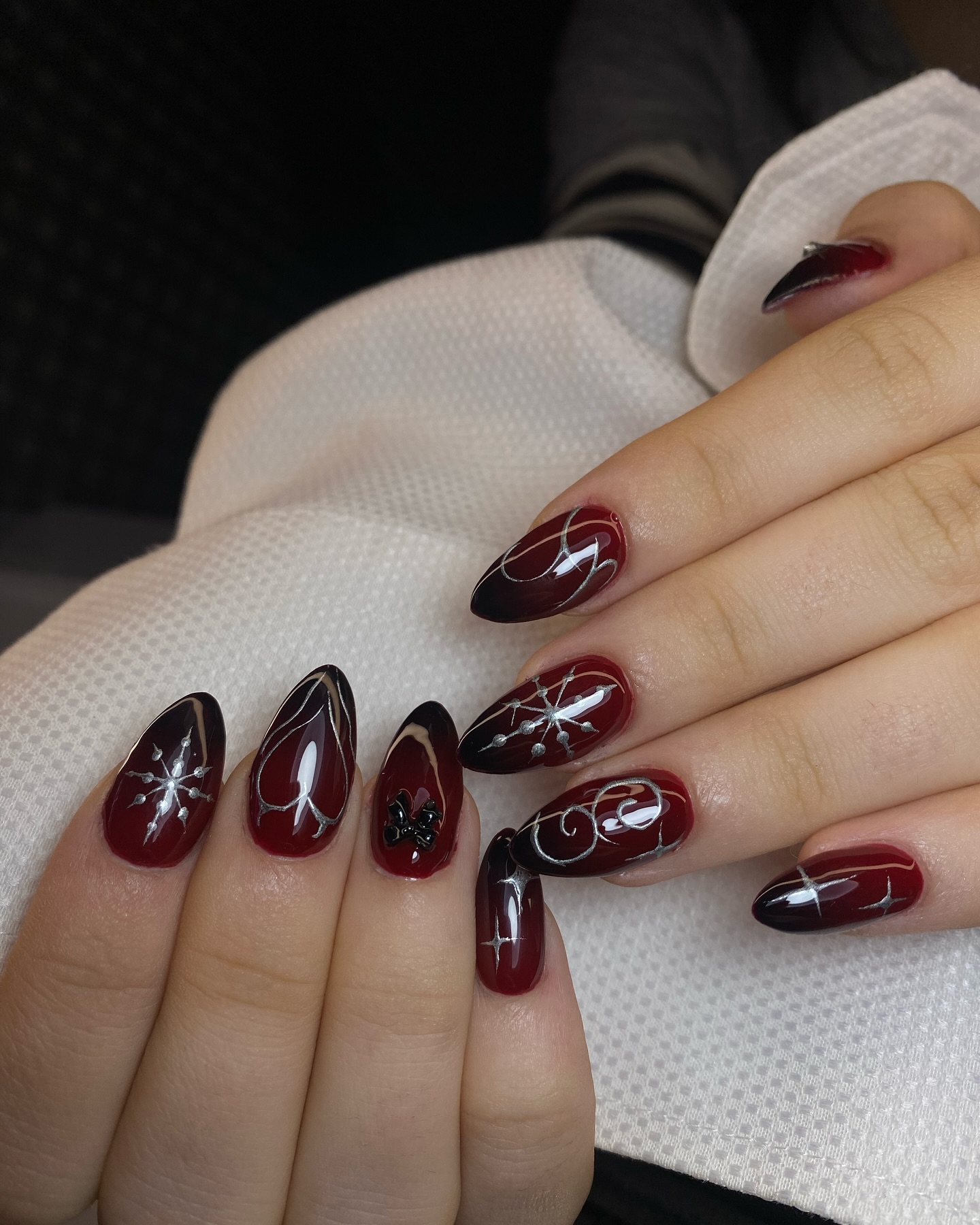 Dark Red Ombre Almond Nails with Silver Swirls