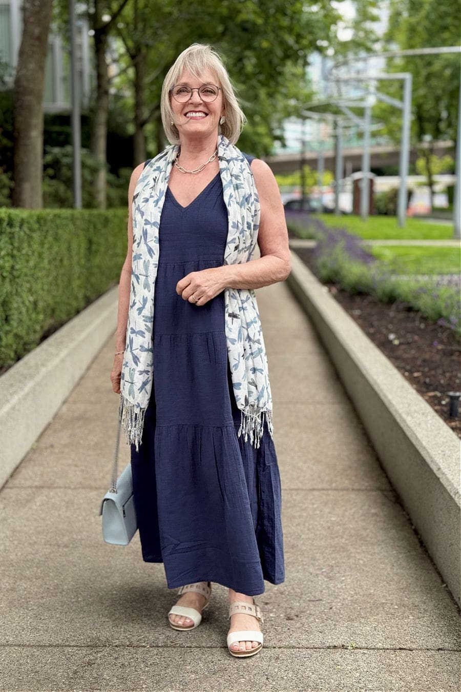 Navy Sleeveless Tiered Cotton Gauze Dress With Light Blue Handbag Navy Sleeveless Tiered Cotton Gauze Dress With Light Blue Handbag — Dresses to Wear