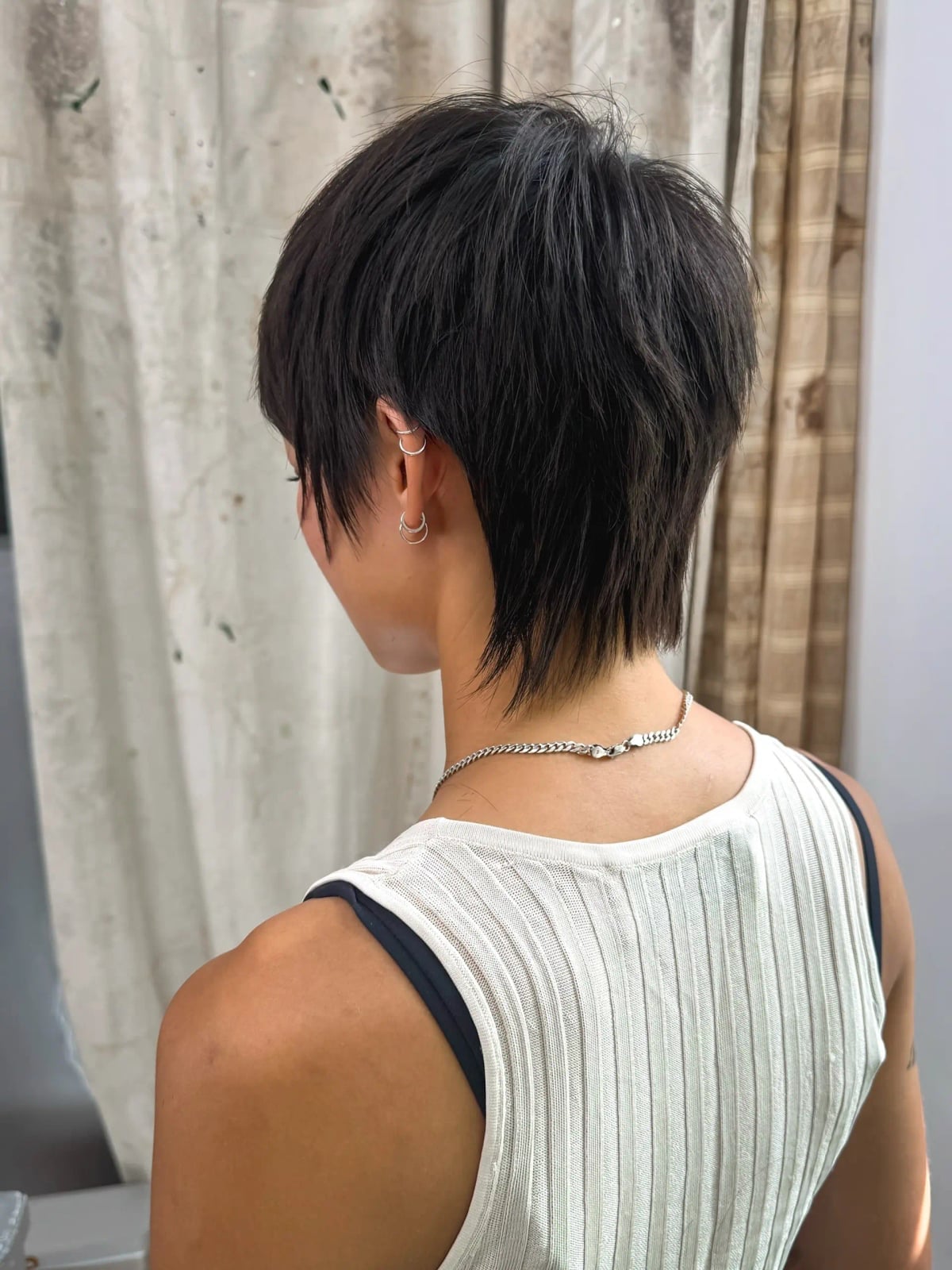 Textured Dark Brown Pixie Mullet Back View Textured Dark Brown Pixie Mullet Back View — Edgy Haircuts