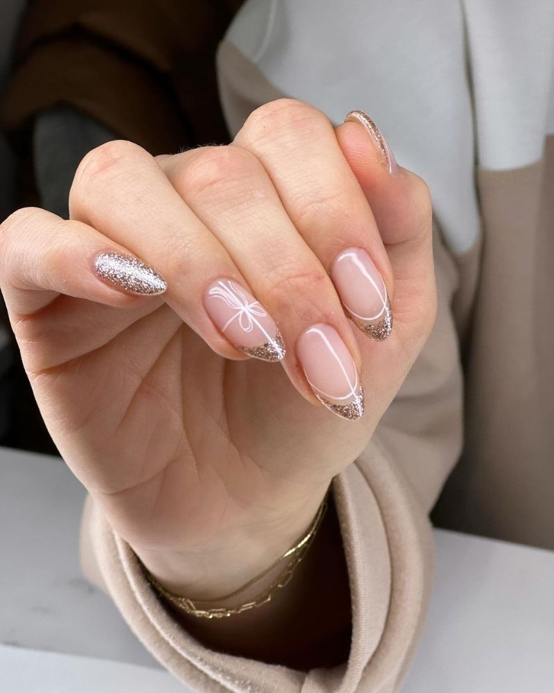 Nude Oval Nails With Silver Snowflakes Nude Oval Nails With Silver Snowflakes — Elegant Christmas Nails