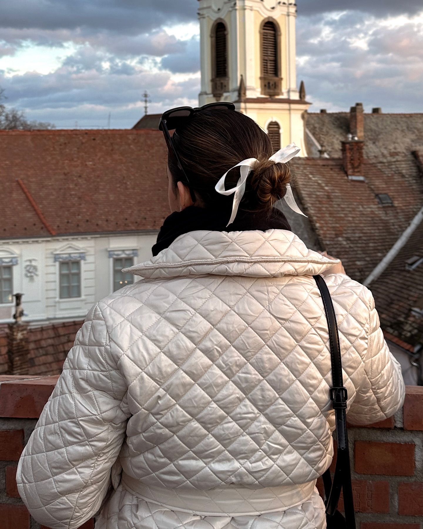Elegant Low Bun With White Ribbon Accent