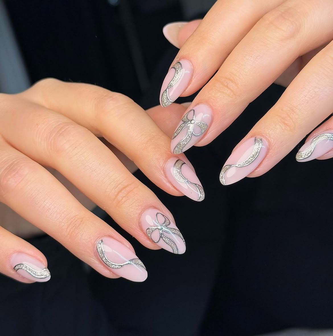Elegant Silver Bow Almond Nails