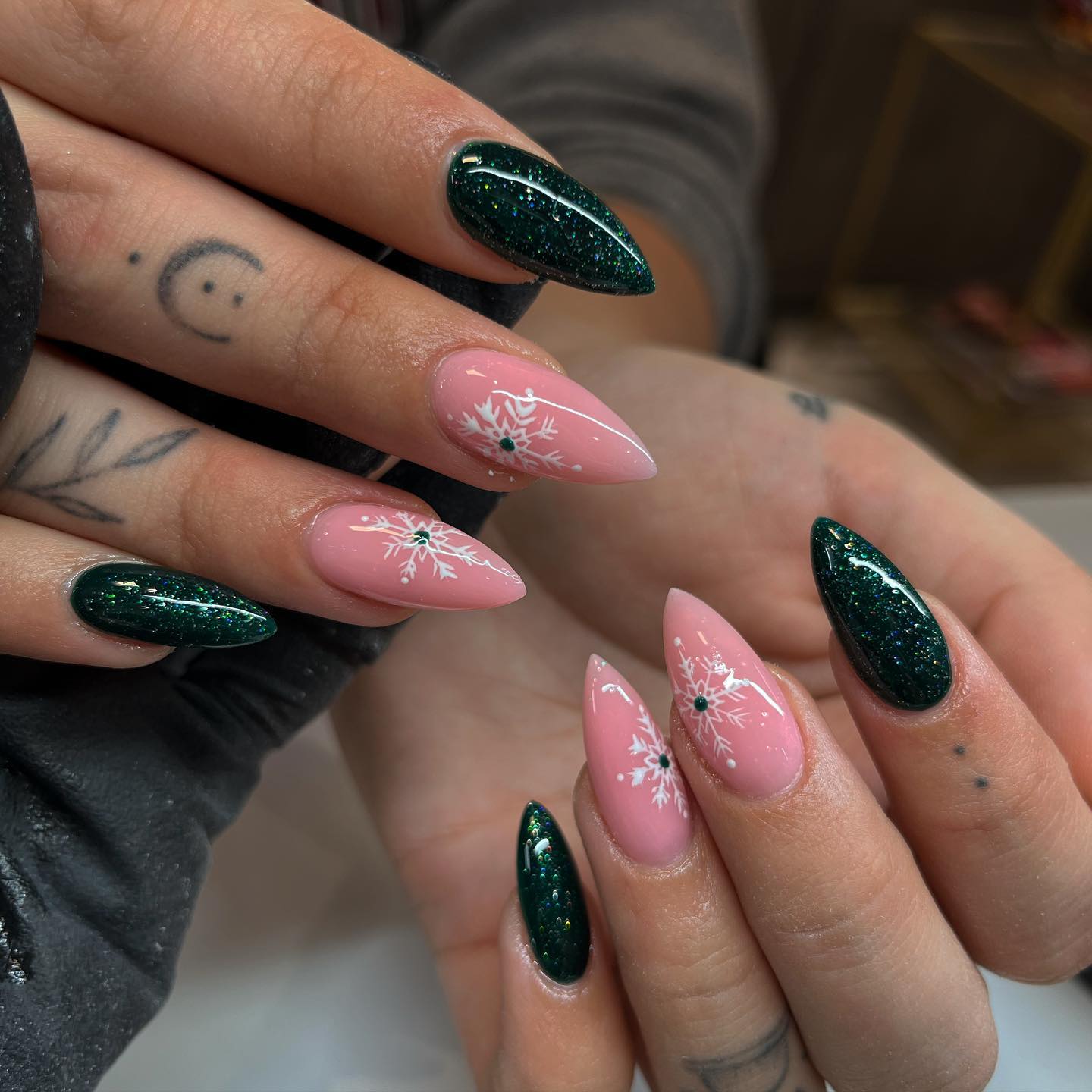 Emerald Glitter and Pink Snowflake Stiletto Nails