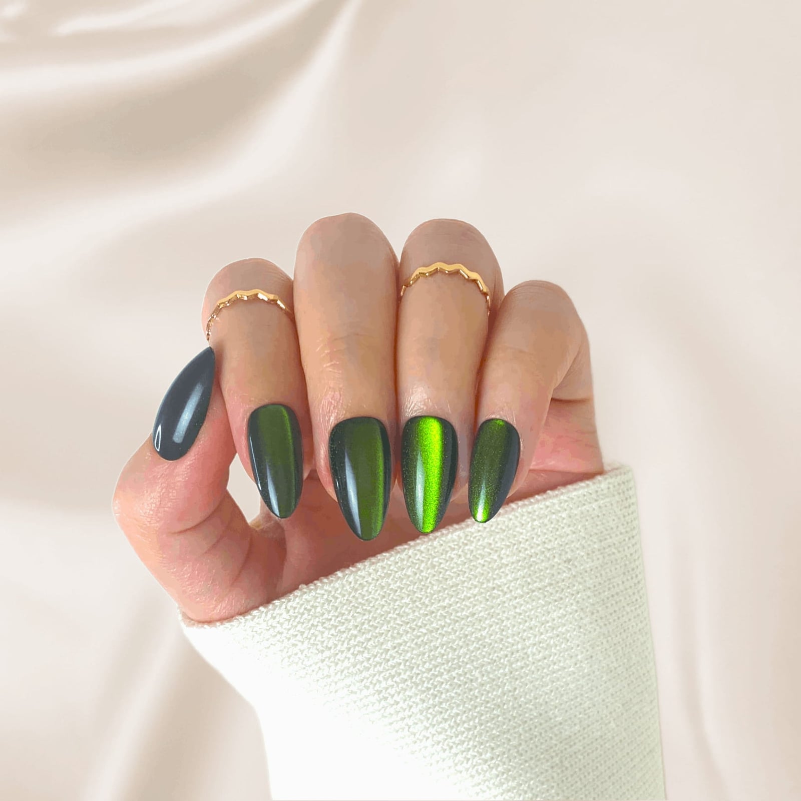 Striking Emerald Green Cat Eye Medium Almond Nails With Creating Depth — Emerald Green Nails