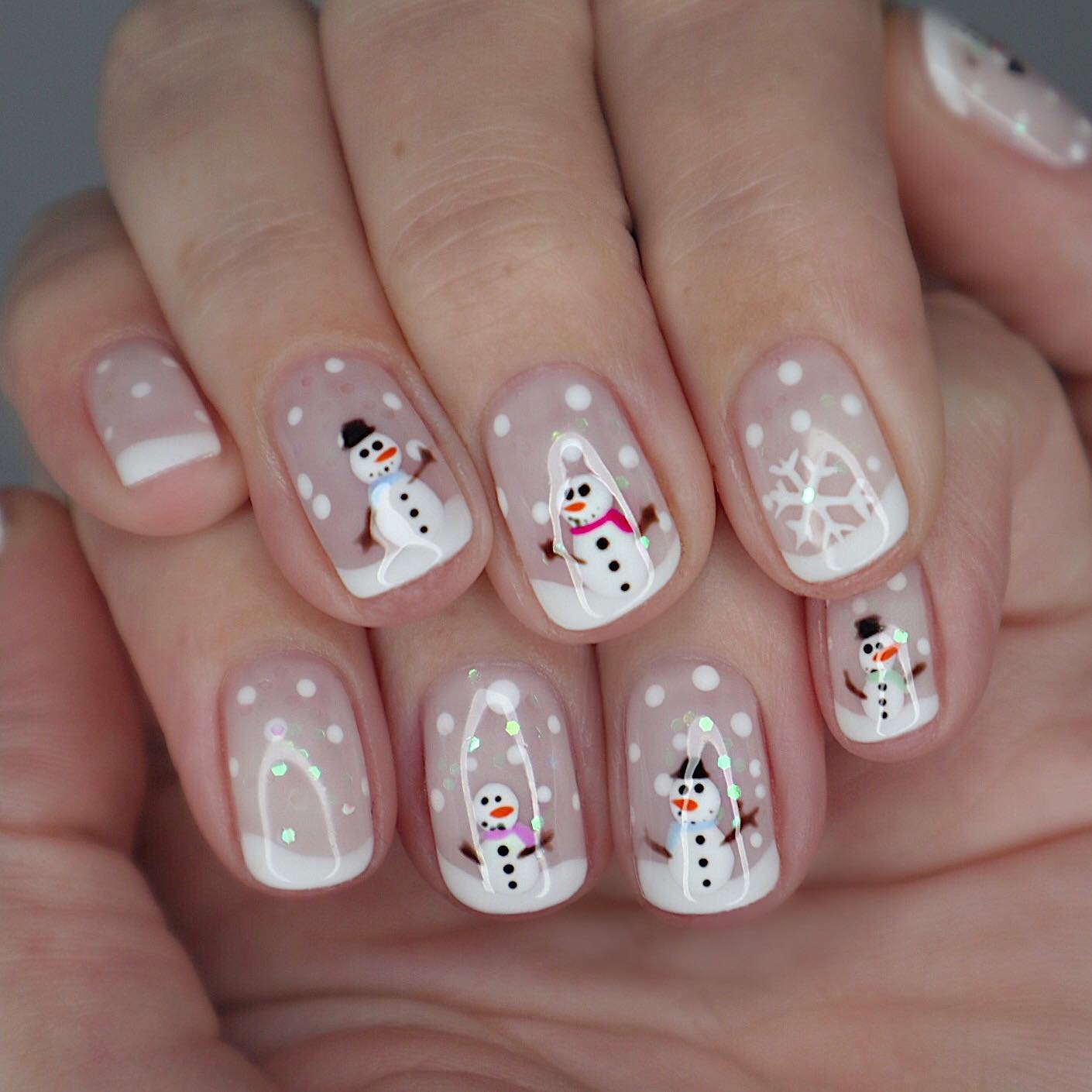 Enchanting Snow Globe Manicure with Cute Snowmen