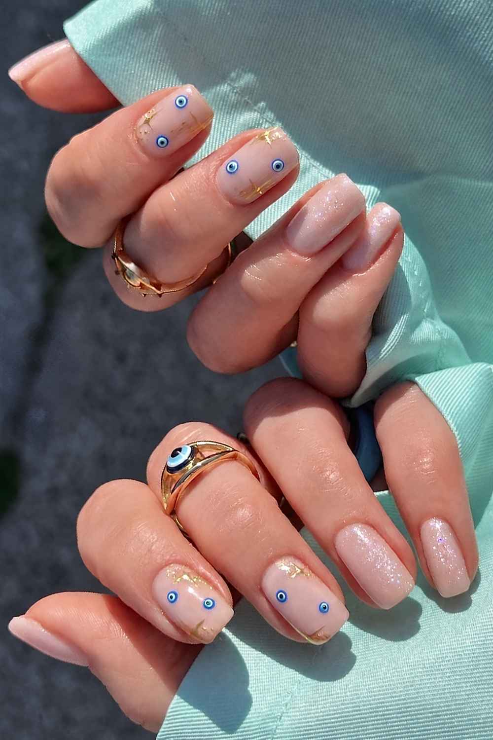 Shimmer Nude Oval Nails With Evil Eye Shimmer Nude Oval Nails With Evil Eye — Evil Eye Nails