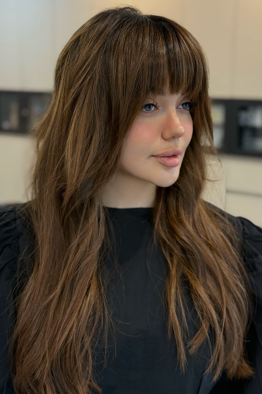 Dark Brown Mid-Back Shag With Full Bangs, A Woman With Long — Face Framing Bangs