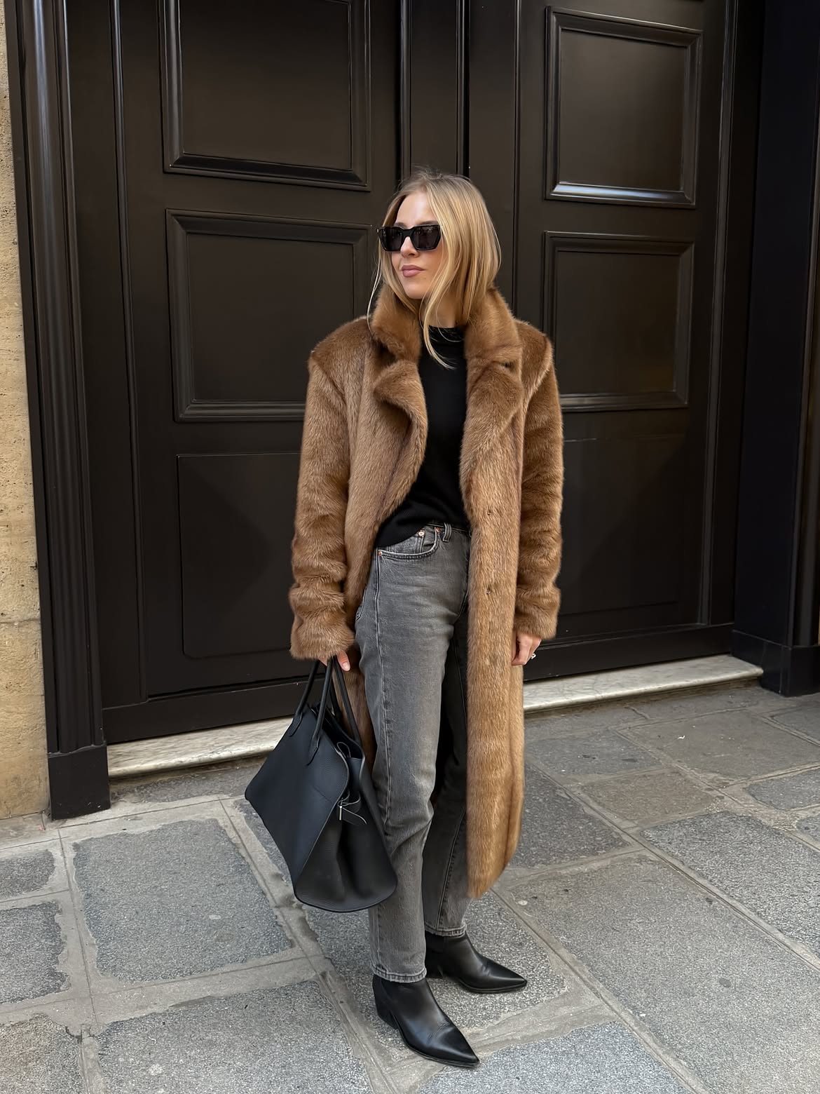 Faux Fur Coat Over Grey Jeans And Boots