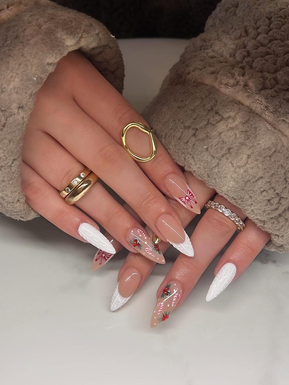 Festive Candy Cane Almond Nails With White Knit Art