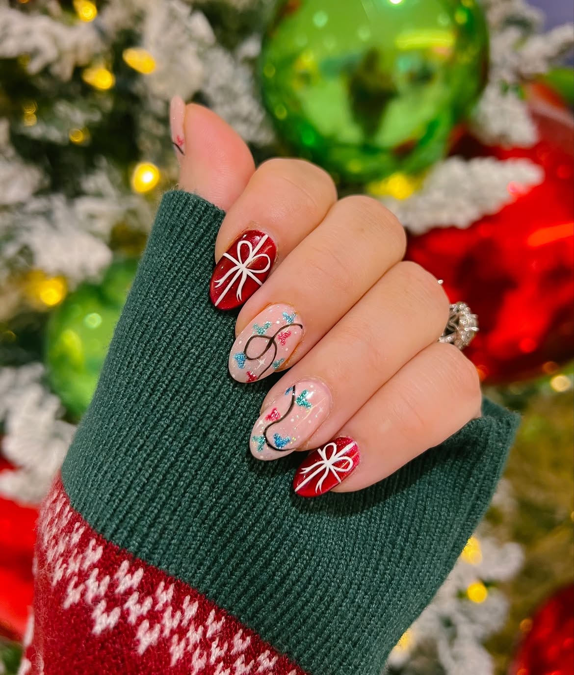 Festive Christmas Lights and Bows Almond Nails