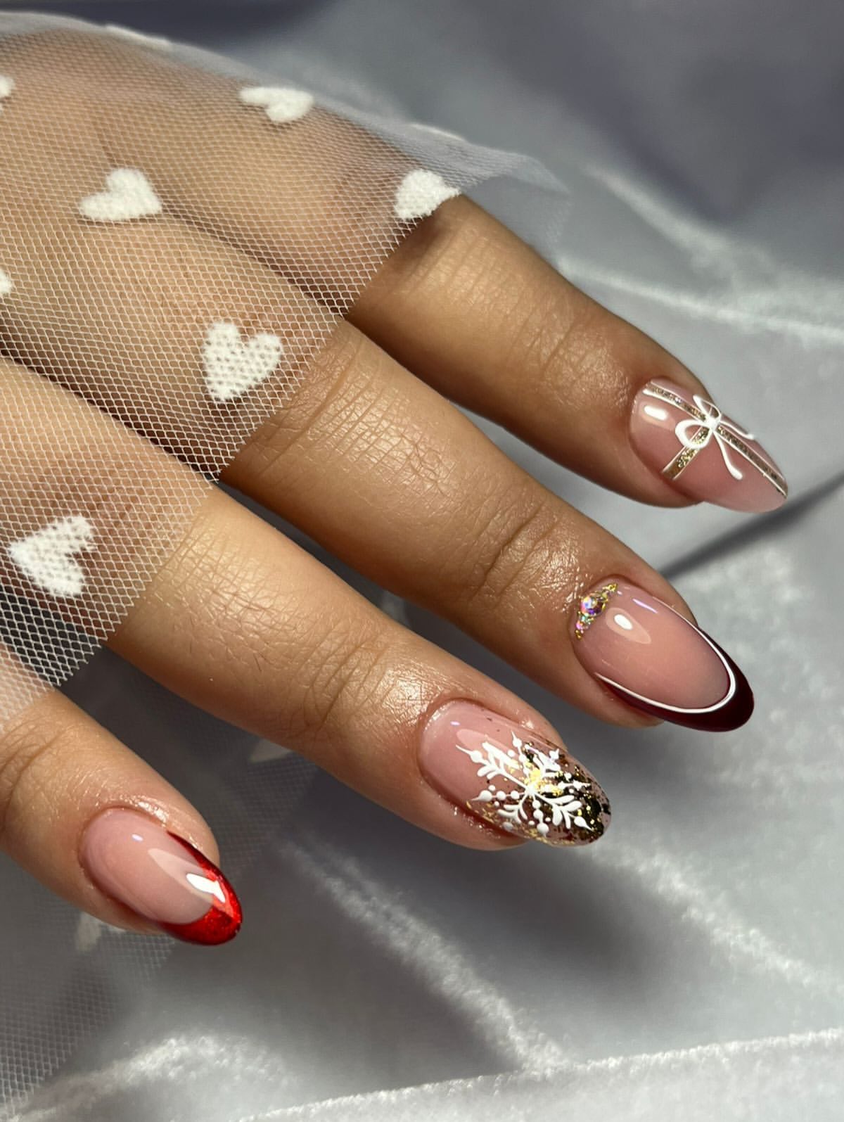 Festive French Tips with Holiday Snowflake Accents
