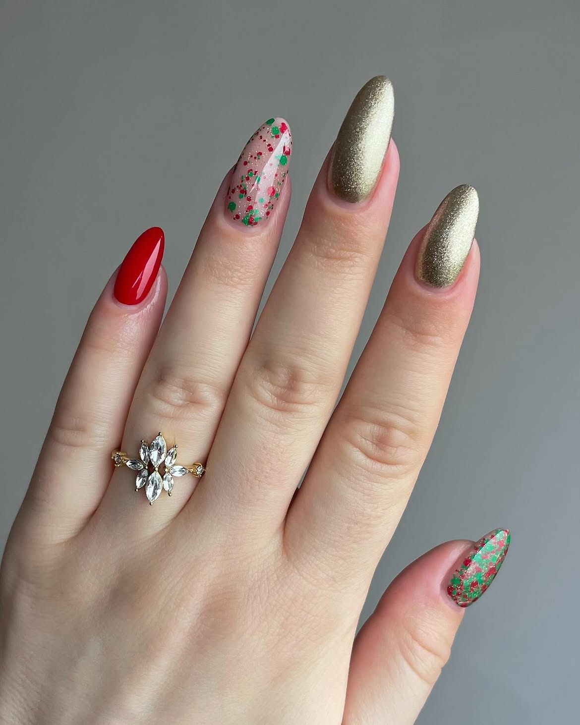 Festive Red And Gold Confetti Almond Nails