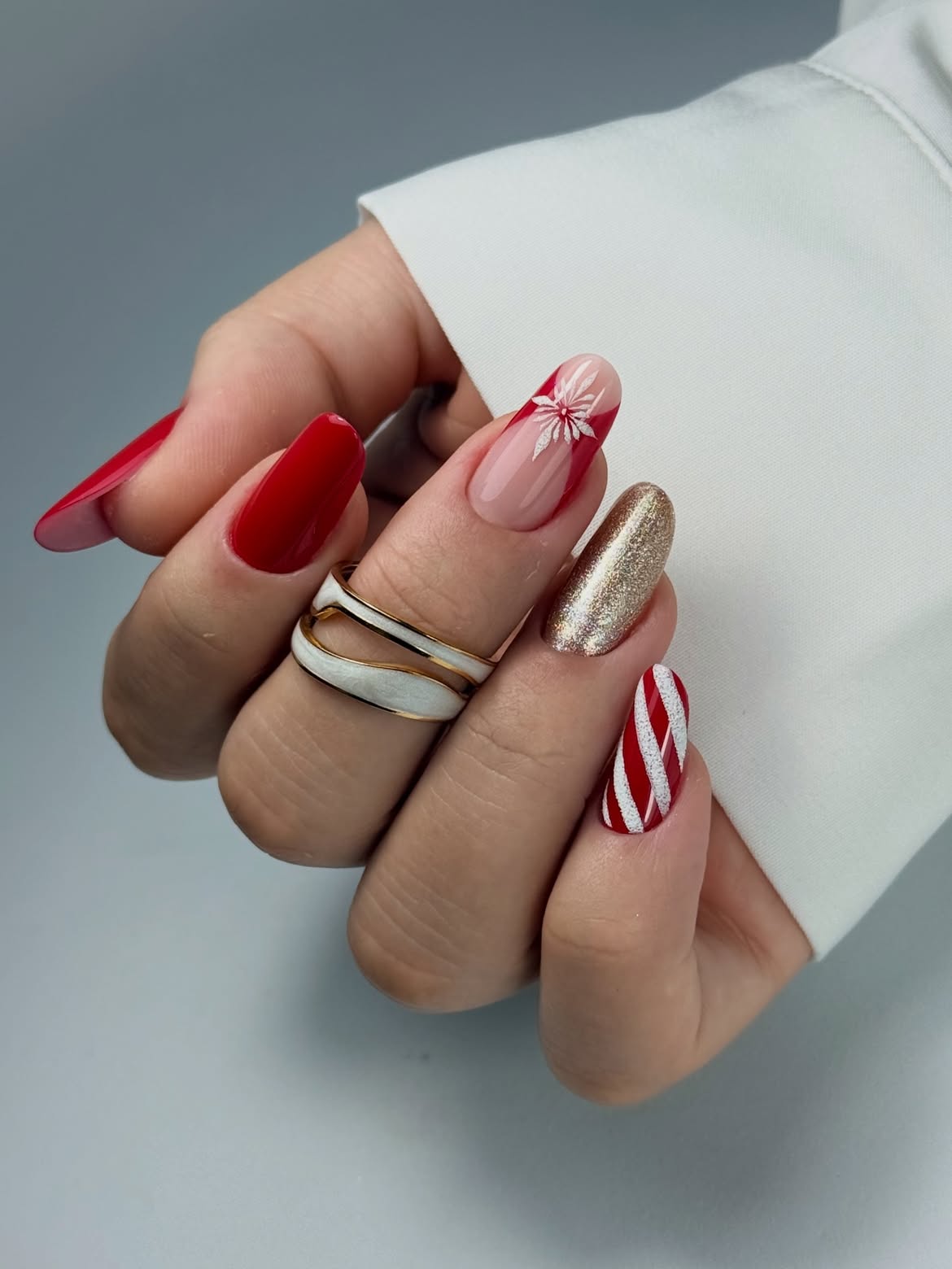 Festive Red And Gold Snowflake Almond Nail Art
