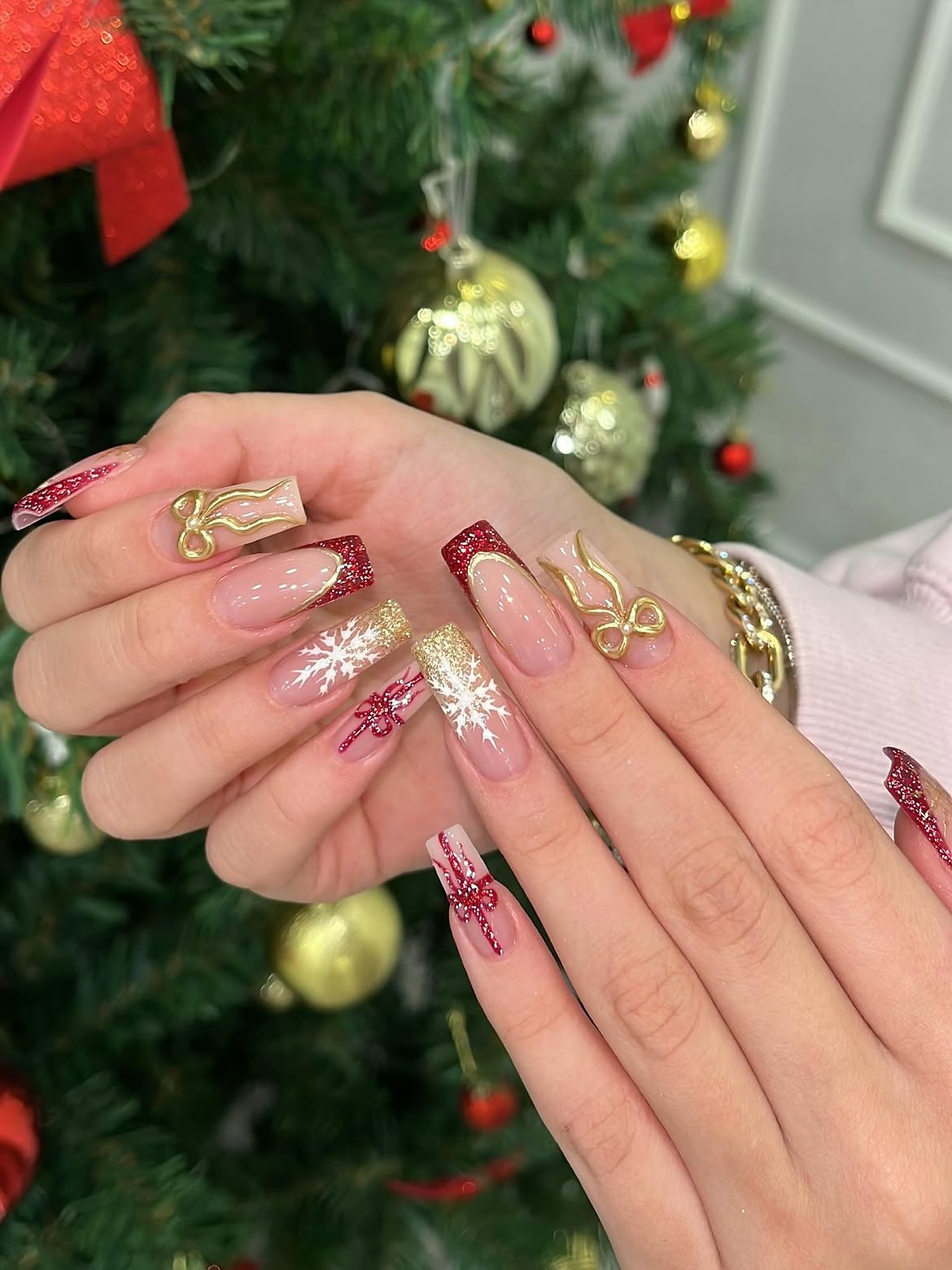 Festive Red And Gold Snowflake Holiday Nails
