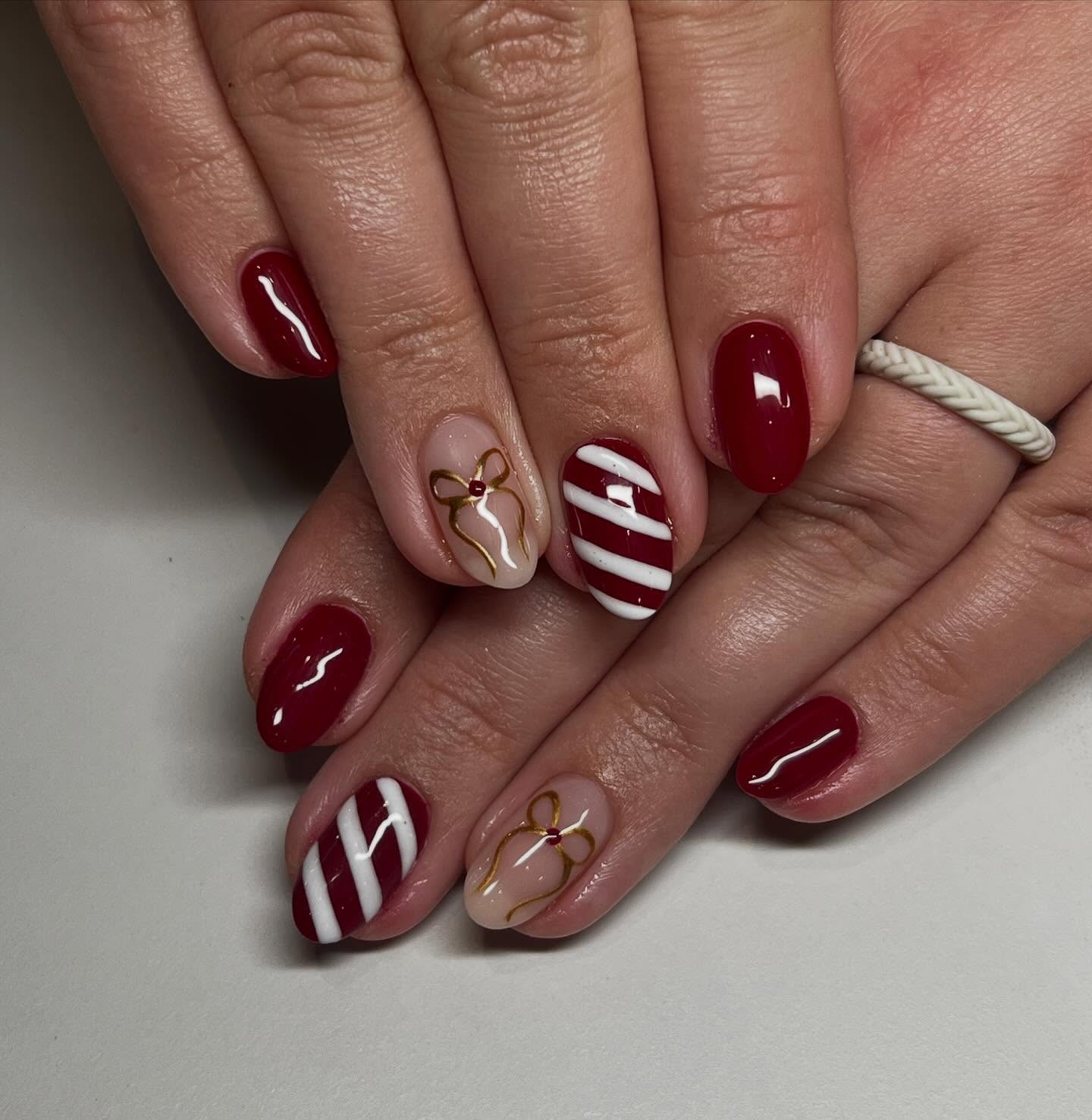Festive Red and White Striped Bow Nails