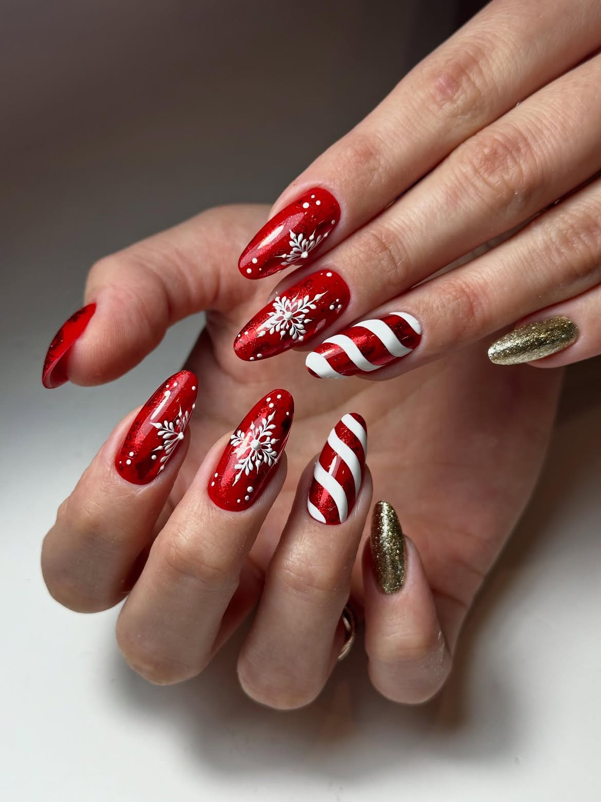 Festive Red Snowflake Candy Cane Nails